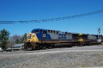 CSX 135 leads a coal train through town.